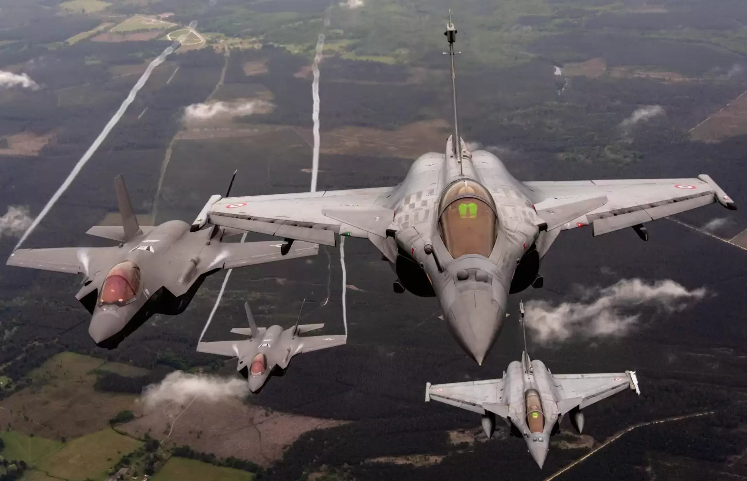 Two US F-35A and two French Rafale fighter jets.